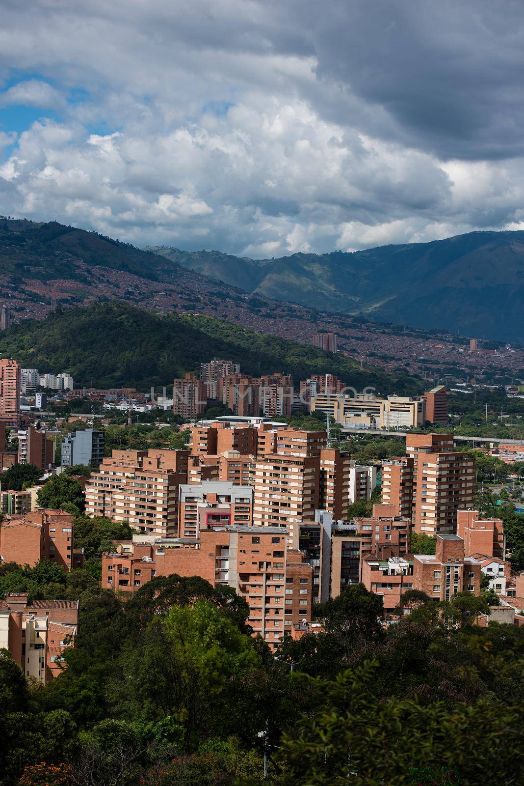 Rolling hills and village of Bogota Colombia. Vertical view