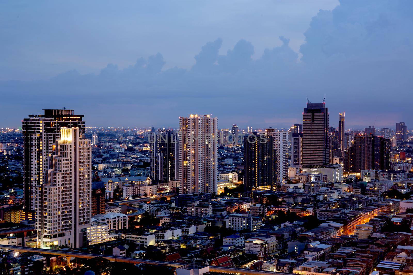 Bangkok THAILAND - July 11 2020 : View landscape of Bangkok tower with river in the evening, downtown and  cityscape in twilight at Thailand, skyscraper and condominium. by nnudoo