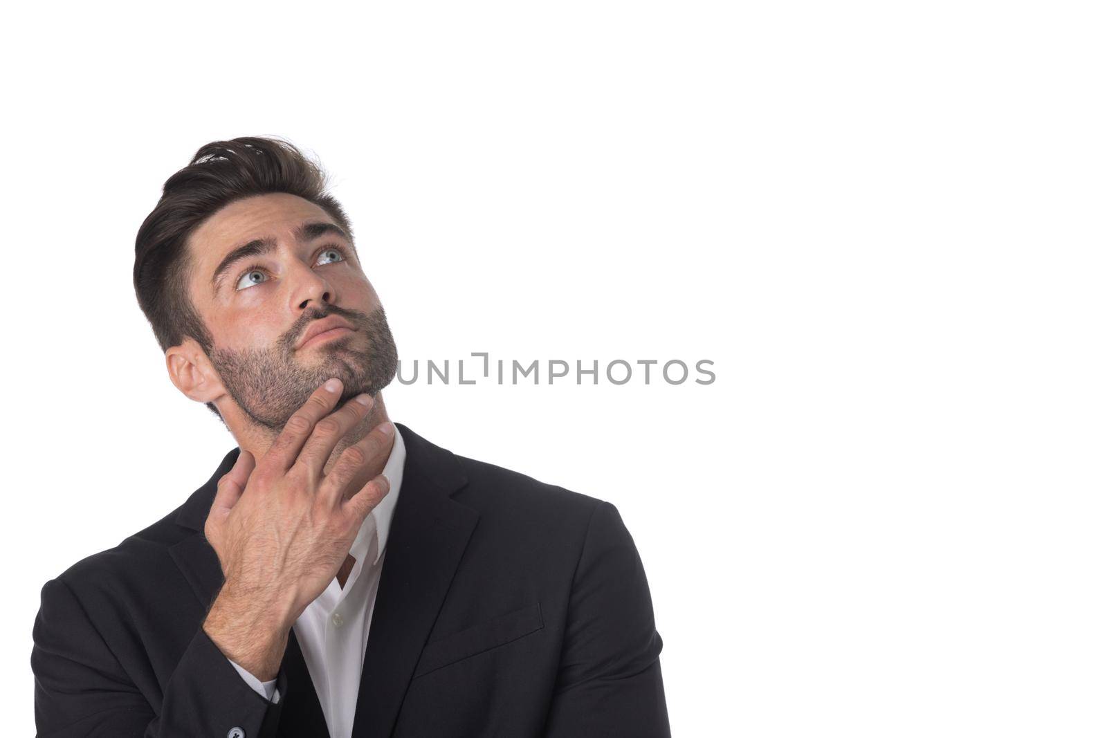 Handsome young business man look up to empty copy space, businessman think, idea, hold hand on chin wear elegant suit isolated on white background