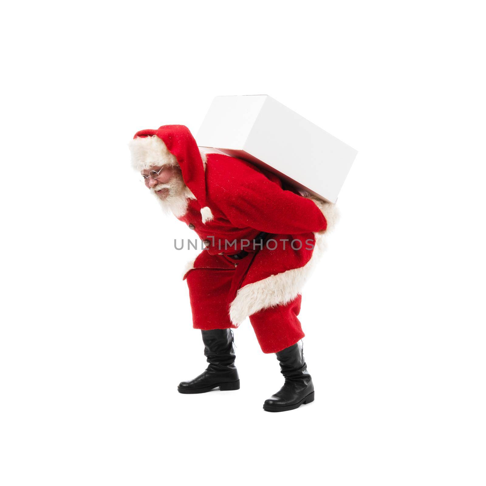 Santa Claus carrying large white gift boxe on his back isolated on white background