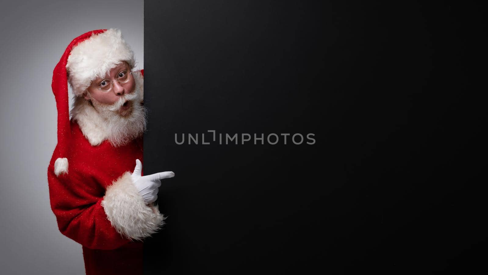 Santa Claus pointing black billboard by ALotOfPeople