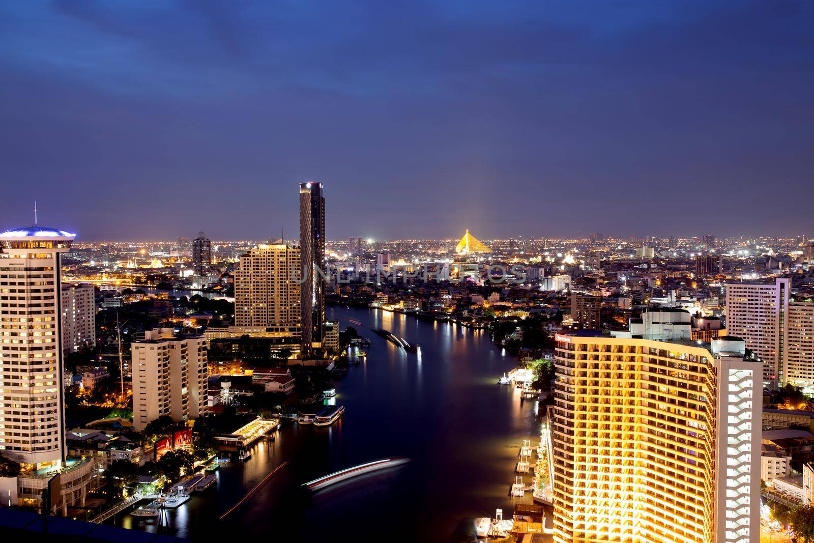 Bangkok THAILAND - July 11 2020 : View landscape of Bangkok tower with river in the evening, downtown and  cityscape in twilight at Thailand, skyscraper and condominium.