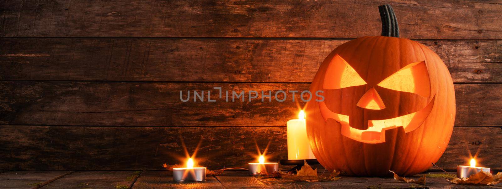 Halloween pumpkin and candles by Yellowj