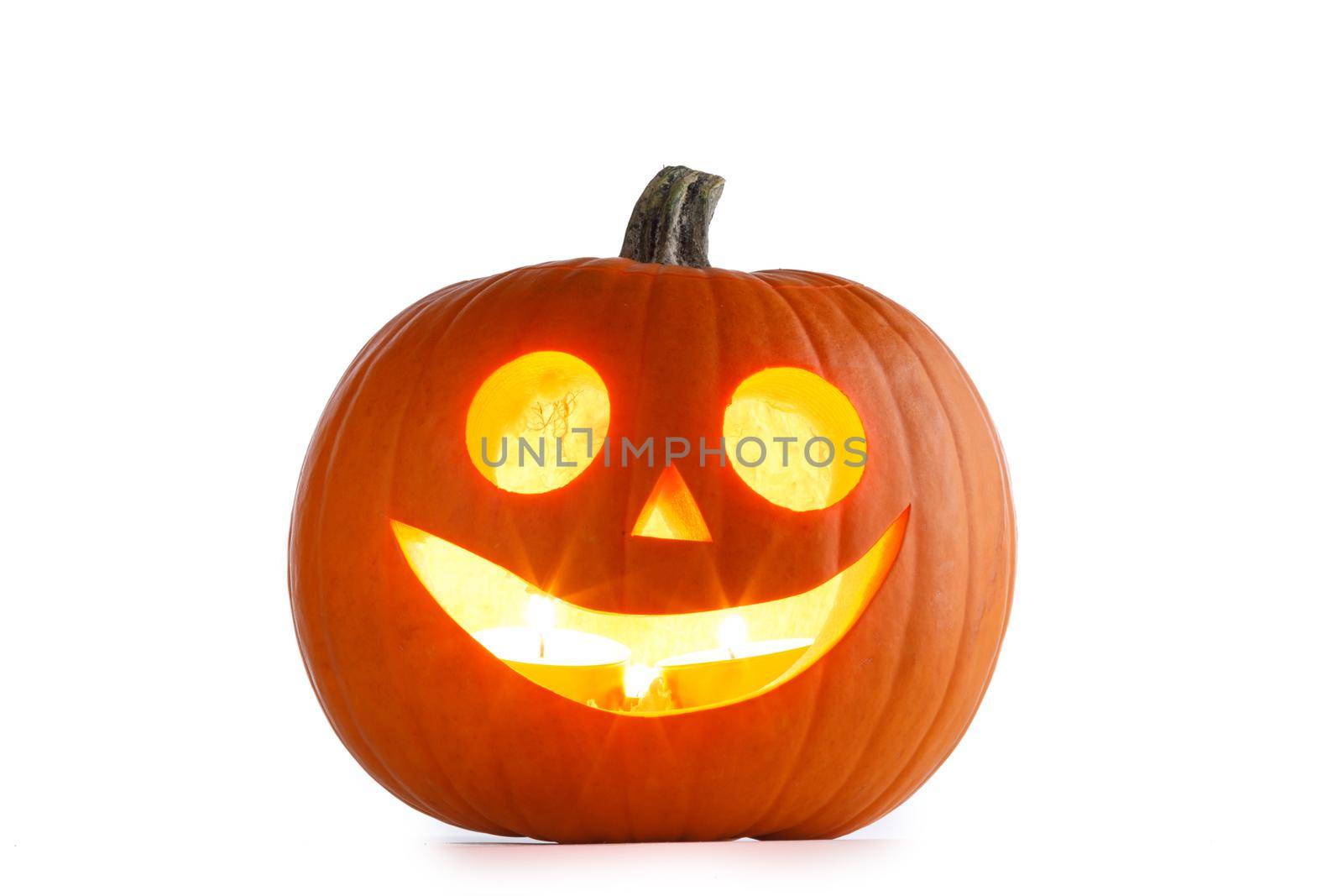 Jack o lantern Halloween pumpkin face on wooden background