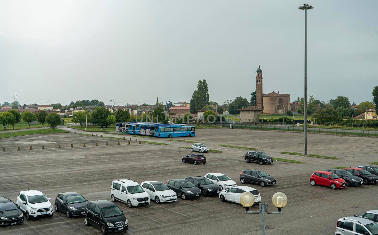 Semi empty car parking in a cloudy day