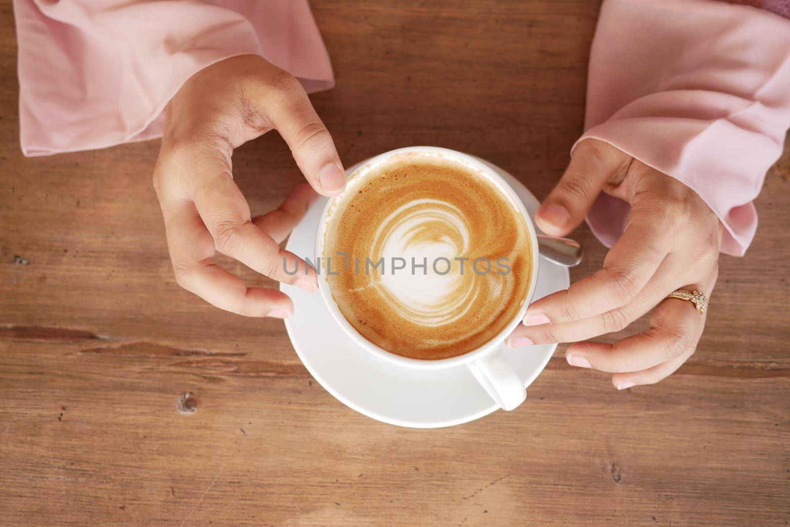 high angle view of women holding coffee cup. by towfiq007