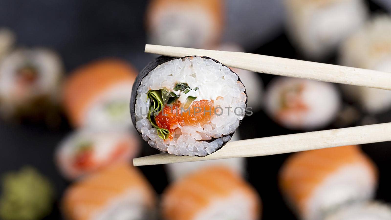 close up chopsticks with sushi roll. Resolution and high quality beautiful photo