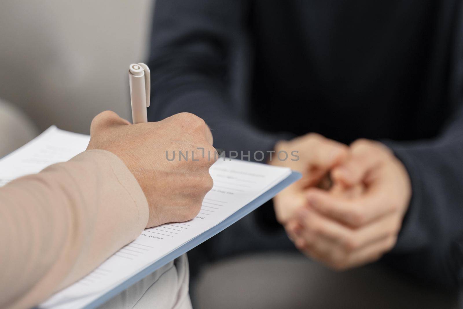 mid shot woman therapist taking notes clipboard. Resolution and high quality beautiful photo