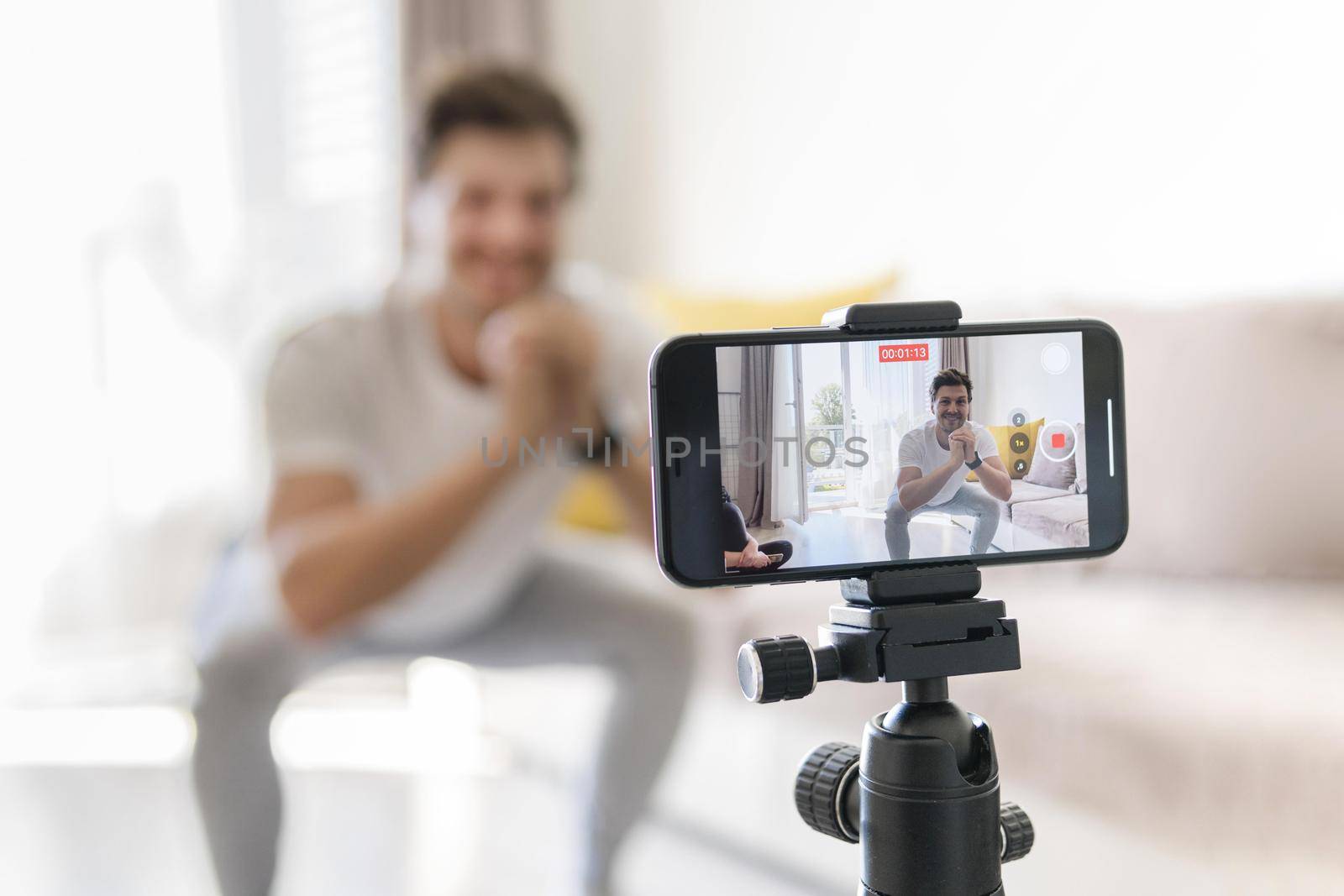 personal trainer recording exercises home. Resolution and high quality beautiful photo