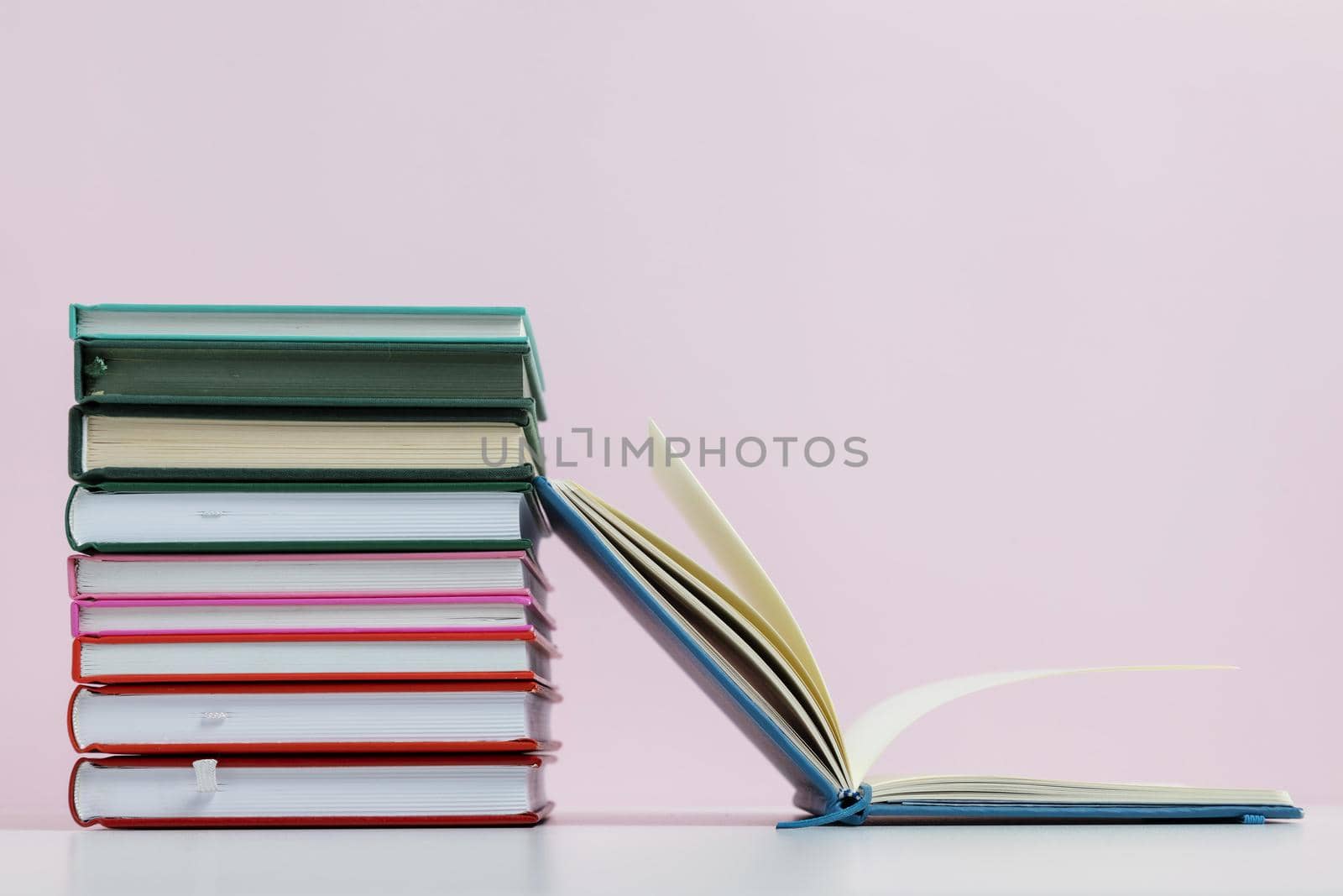 colorful books with pink background arrangement. Resolution and high quality beautiful photo