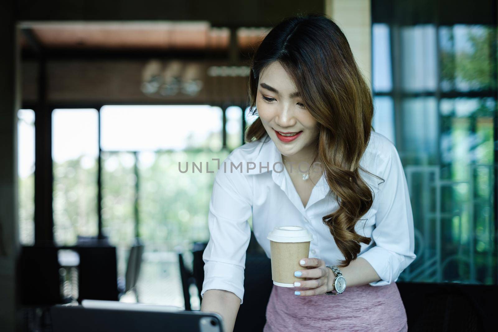 Businesswoman in having a video call on laptop while discussion with business partner during work from home. by itchaznong