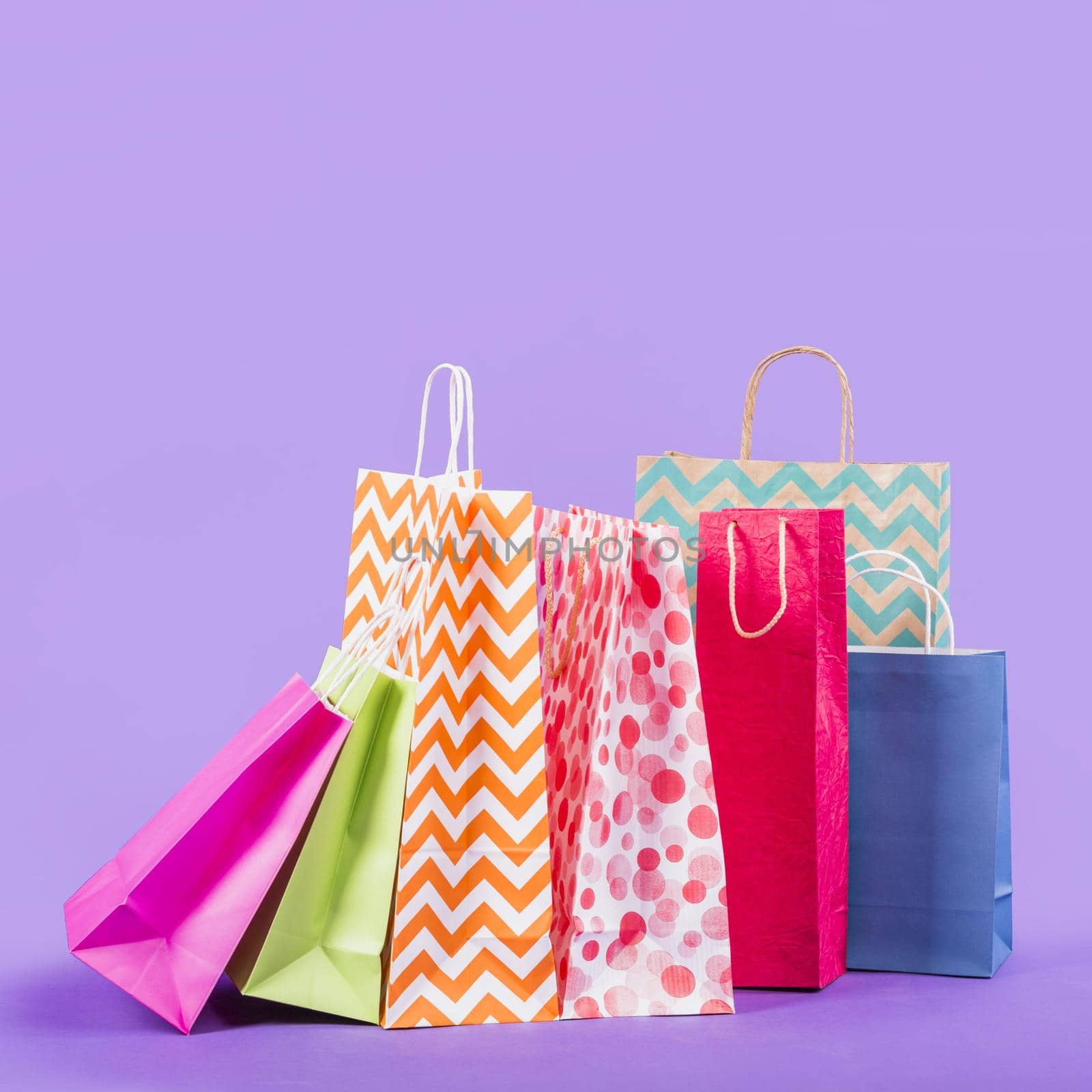 colorful empty shopping bags purple background. Resolution and high quality beautiful photo