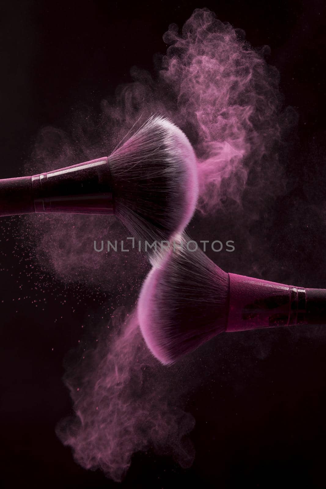 cosmetic brushes pink mist powder dark background. High quality beautiful photo concept by Zahard