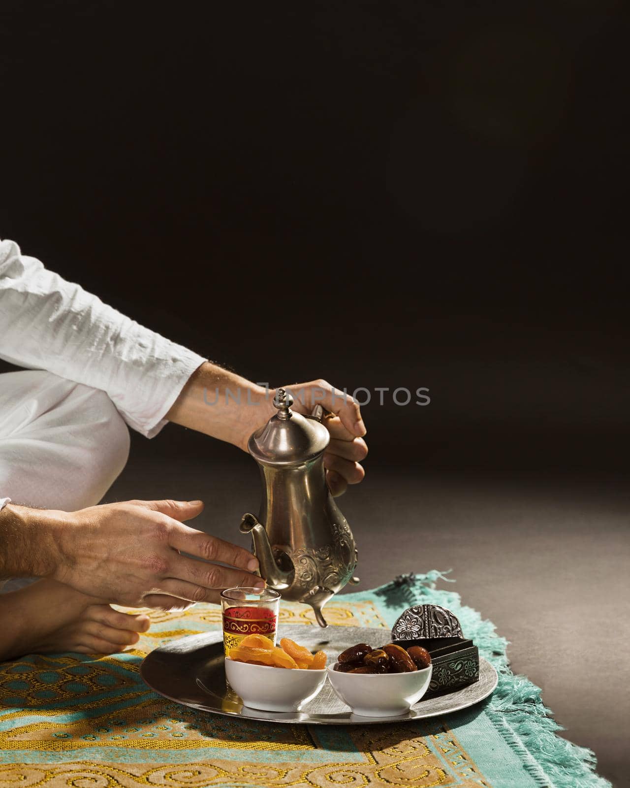 man white pouring tea tiny cup front view. High quality beautiful photo concept by Zahard