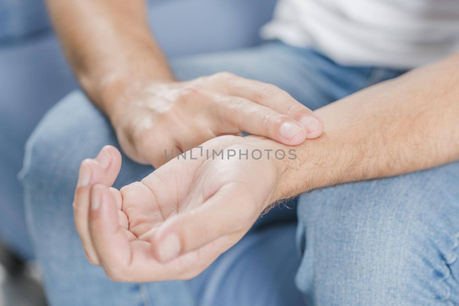 close up man s hand checking pulse. Resolution and high quality beautiful photo