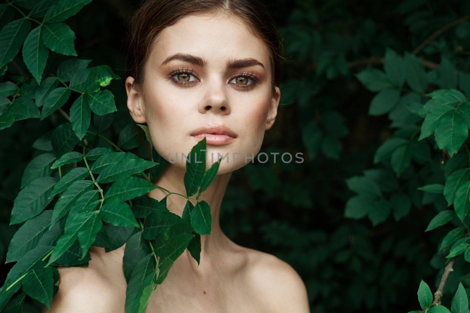 smiling woman Cosmetology nature green leaves glamor Lifestyle. High quality photo