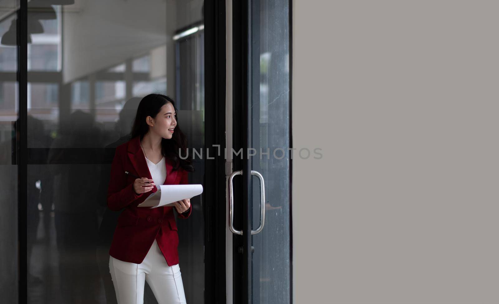 Cropped shot of young asian woman pencil while working for financial in office by nateemee