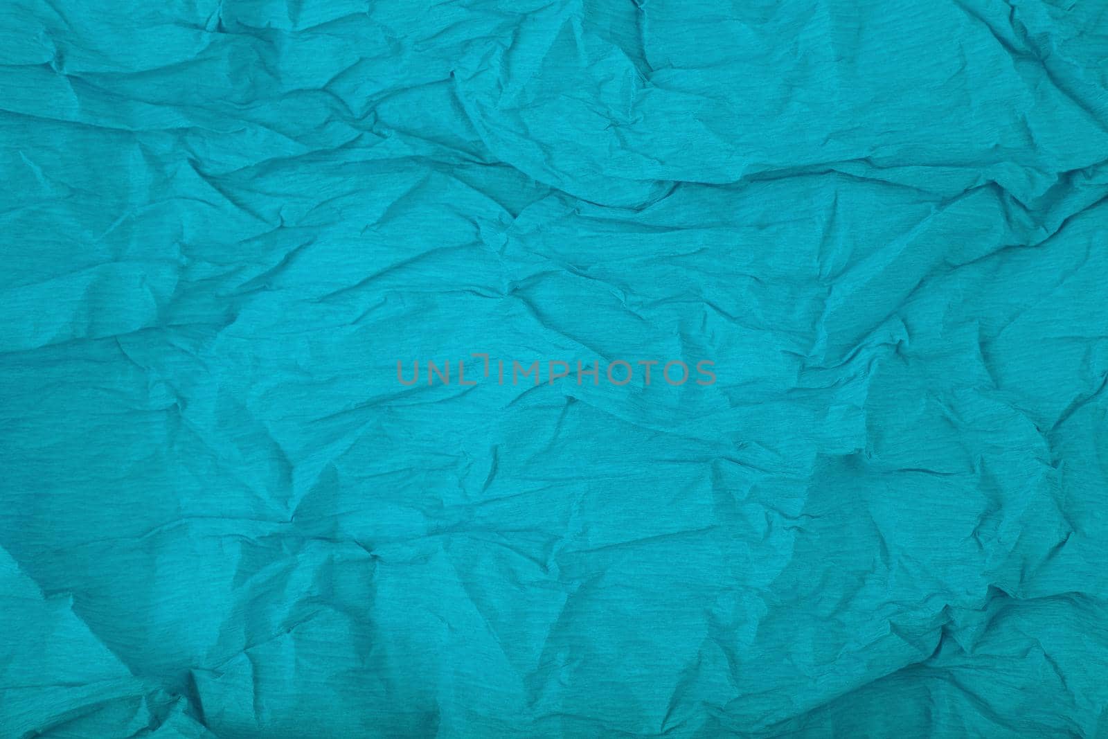 Aqua blue crumpled corrugated wrapping paper background with space for text by Senorina_Irina