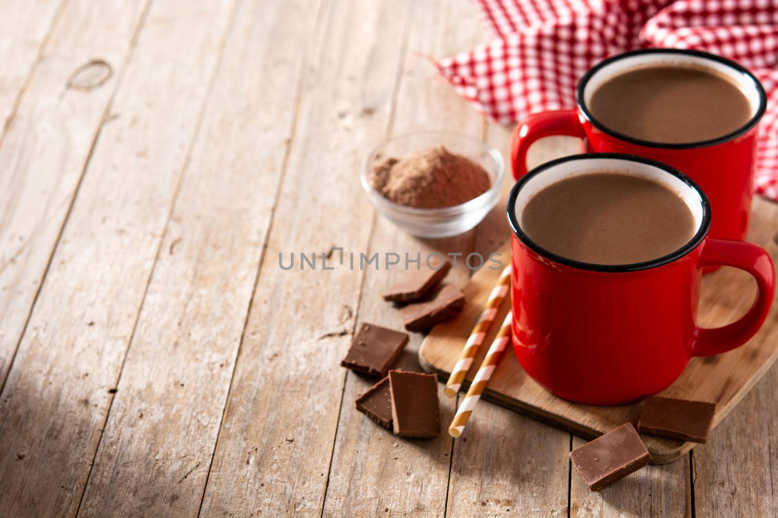 Traditional Mexican chocolate atole drink on wooden table