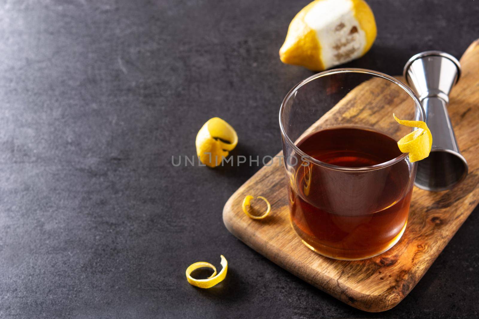 New Orleans sazerac cocktail on black slate background