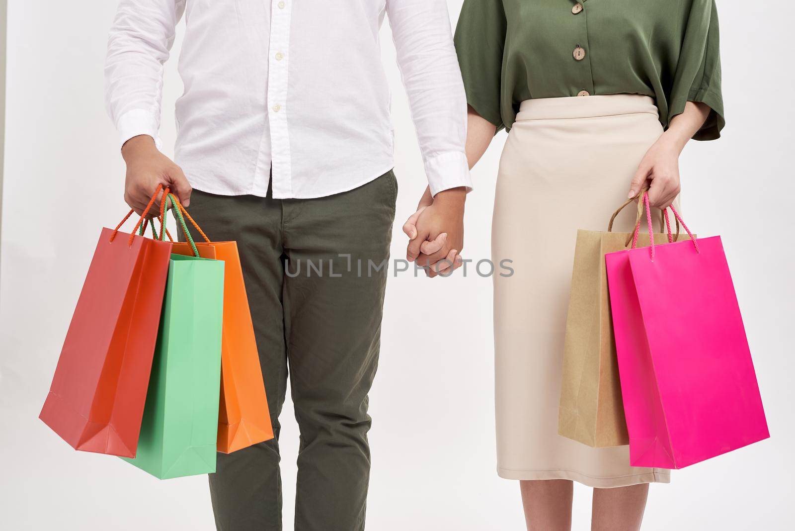 Woman and man holding shopping bags with copy space by makidotvn