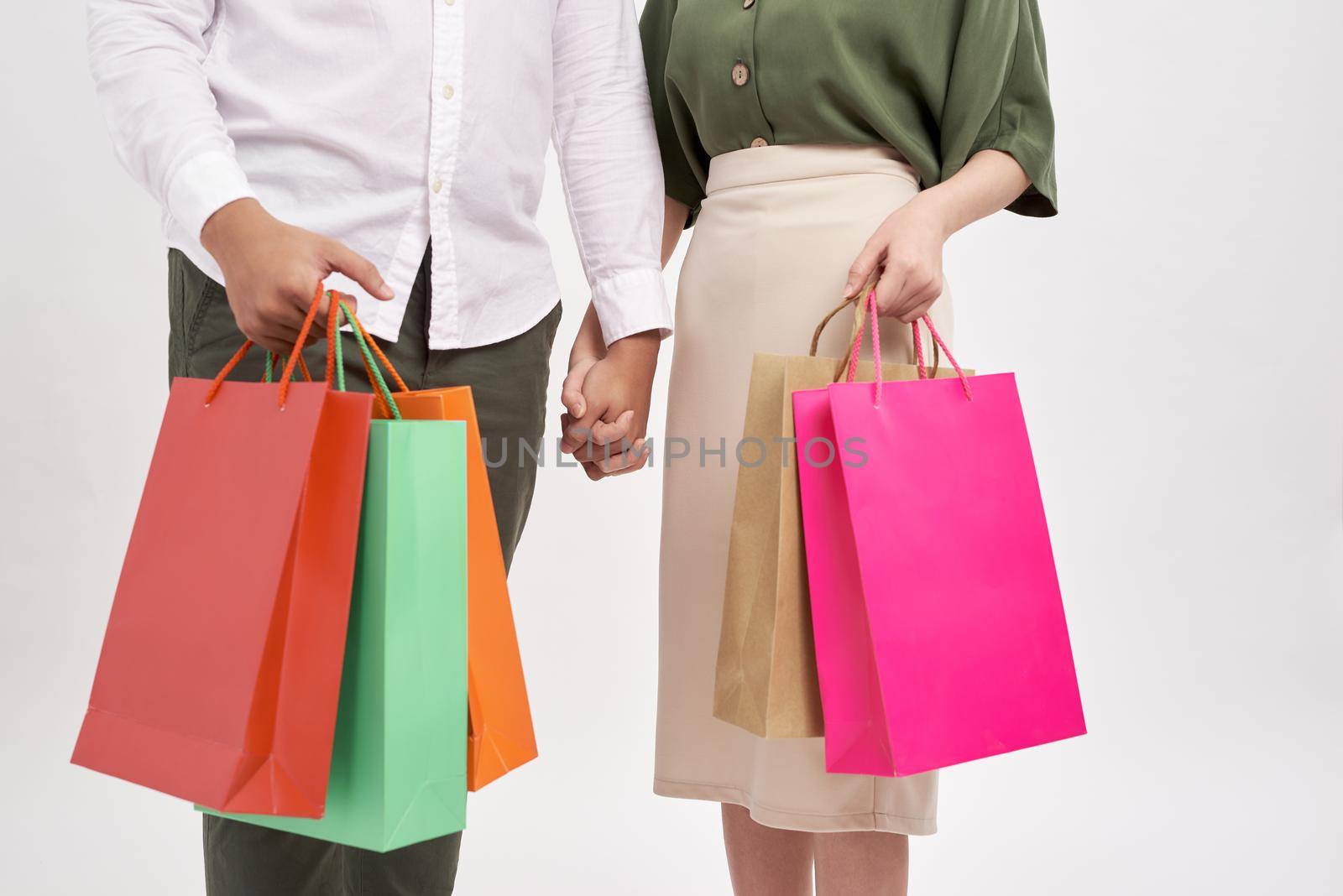 Woman and man holding shopping bags with copy space by makidotvn