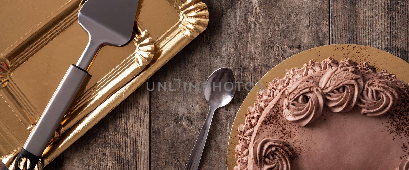 Piece of chocolate truffle cake on wooden table