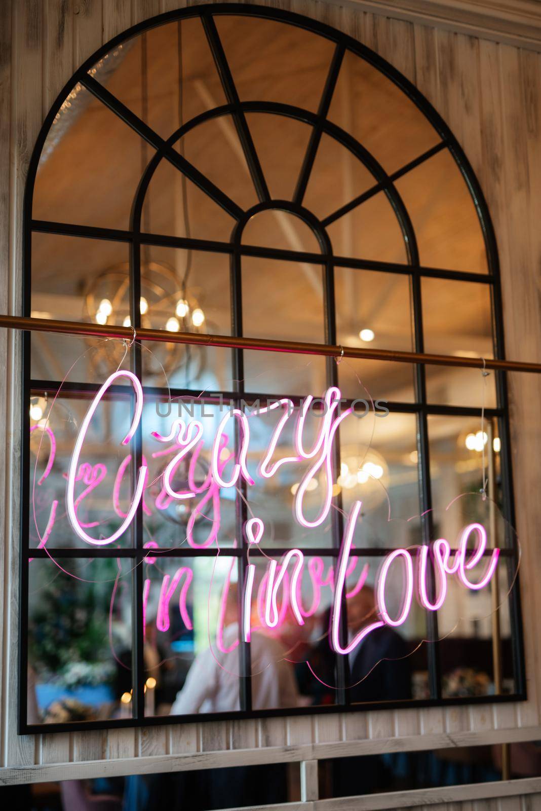 neon lettering in pink on a transparent border