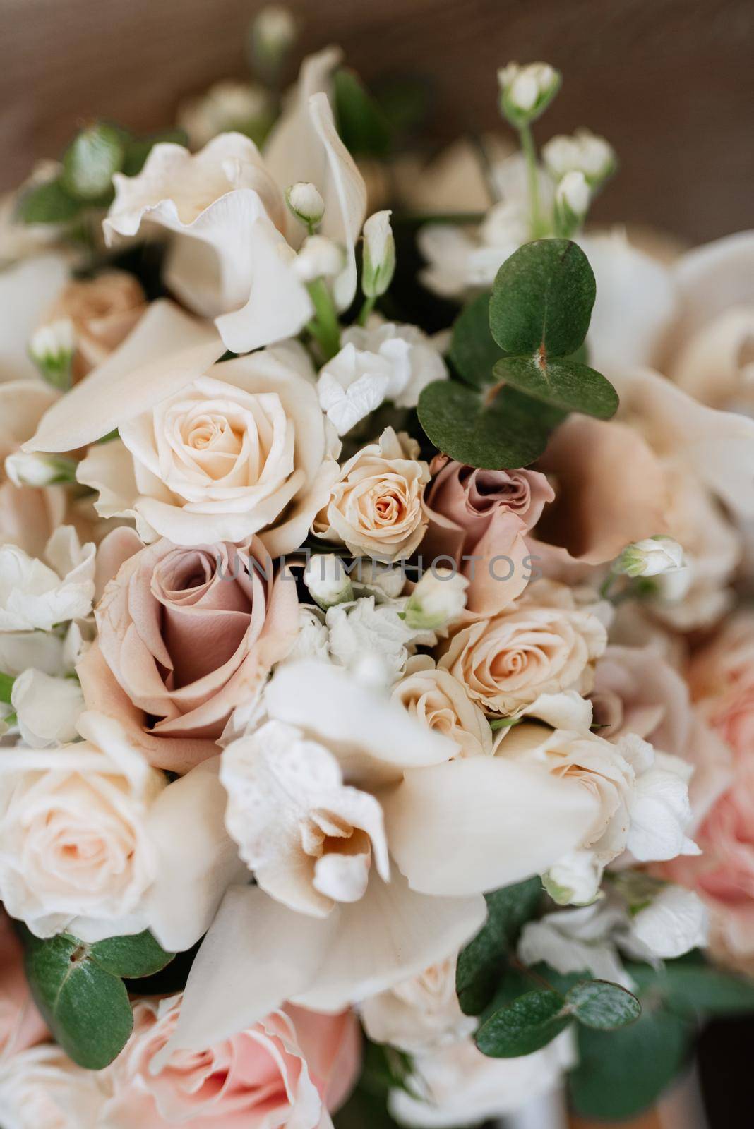 elegant wedding bouquet of fresh natural flowers and greenery