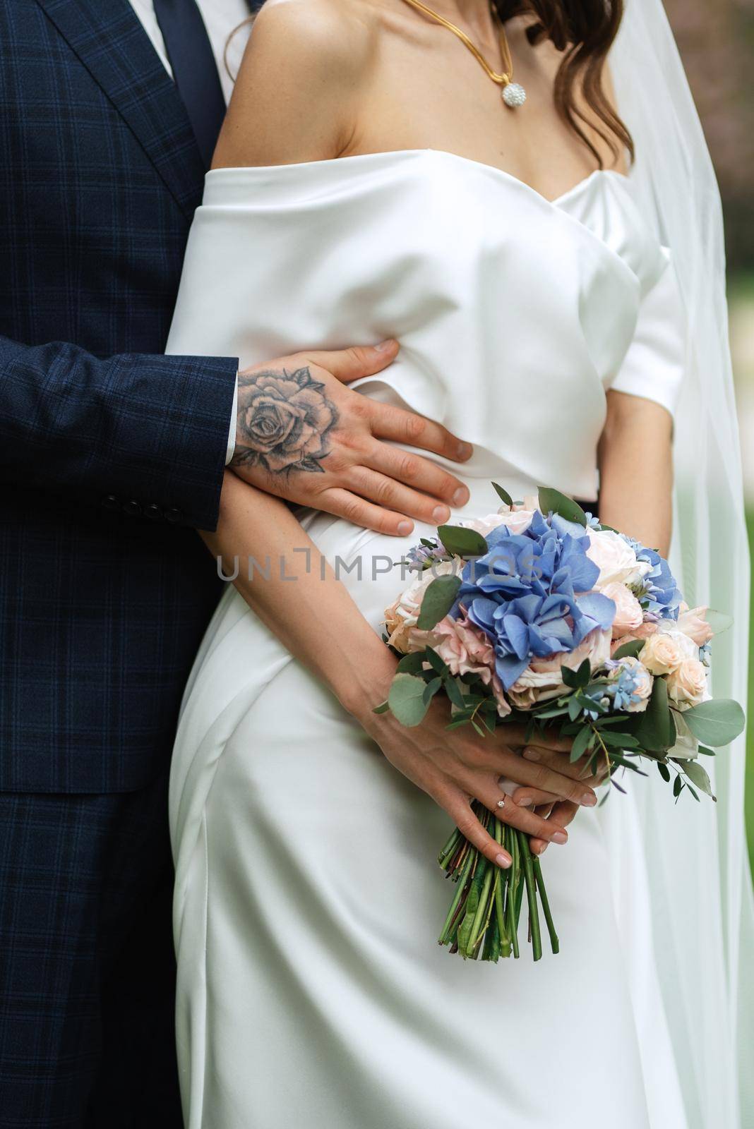 elegant wedding bouquet of fresh natural flowers and greenery