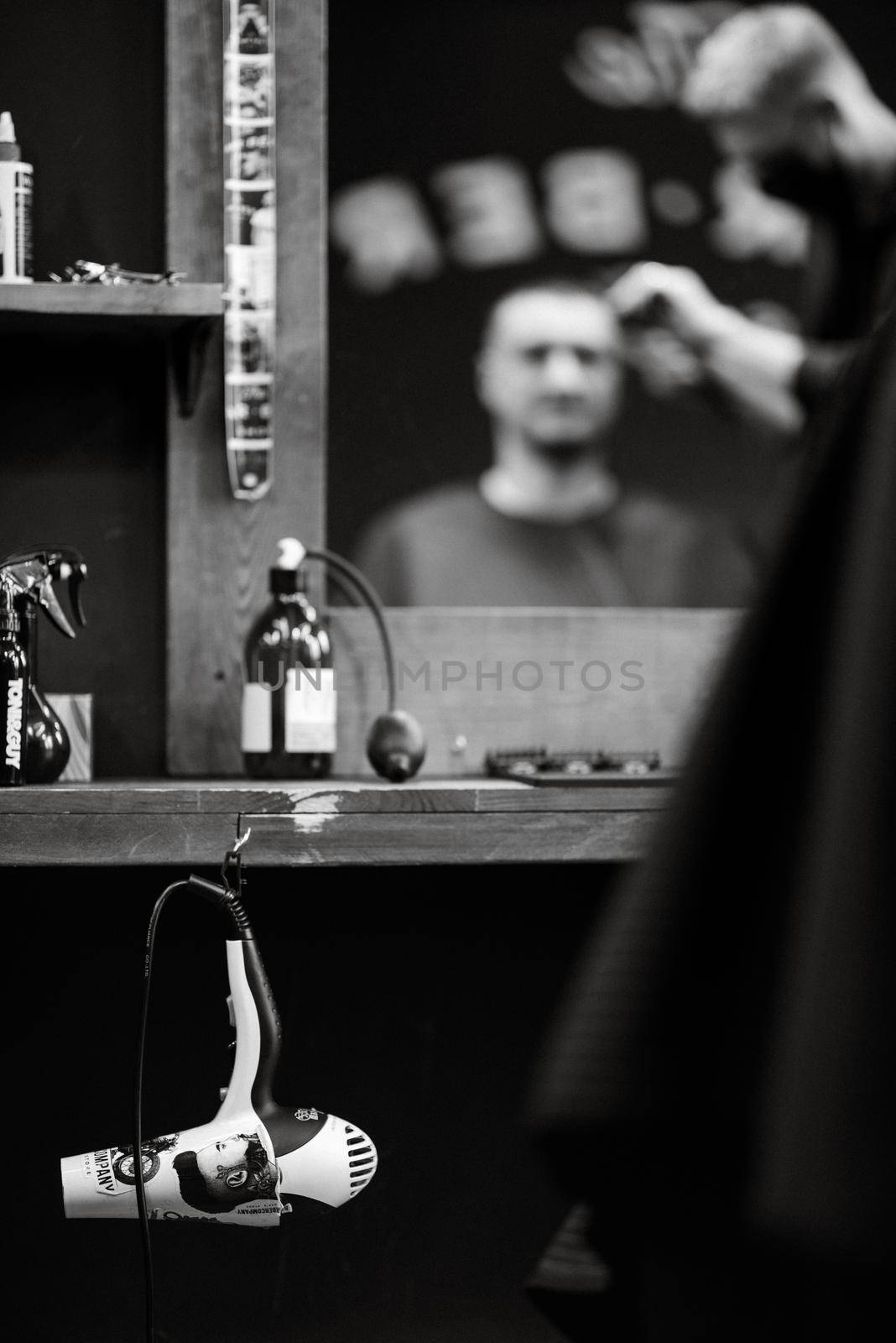 the tools of a Barber on the desktop in front of the mirror