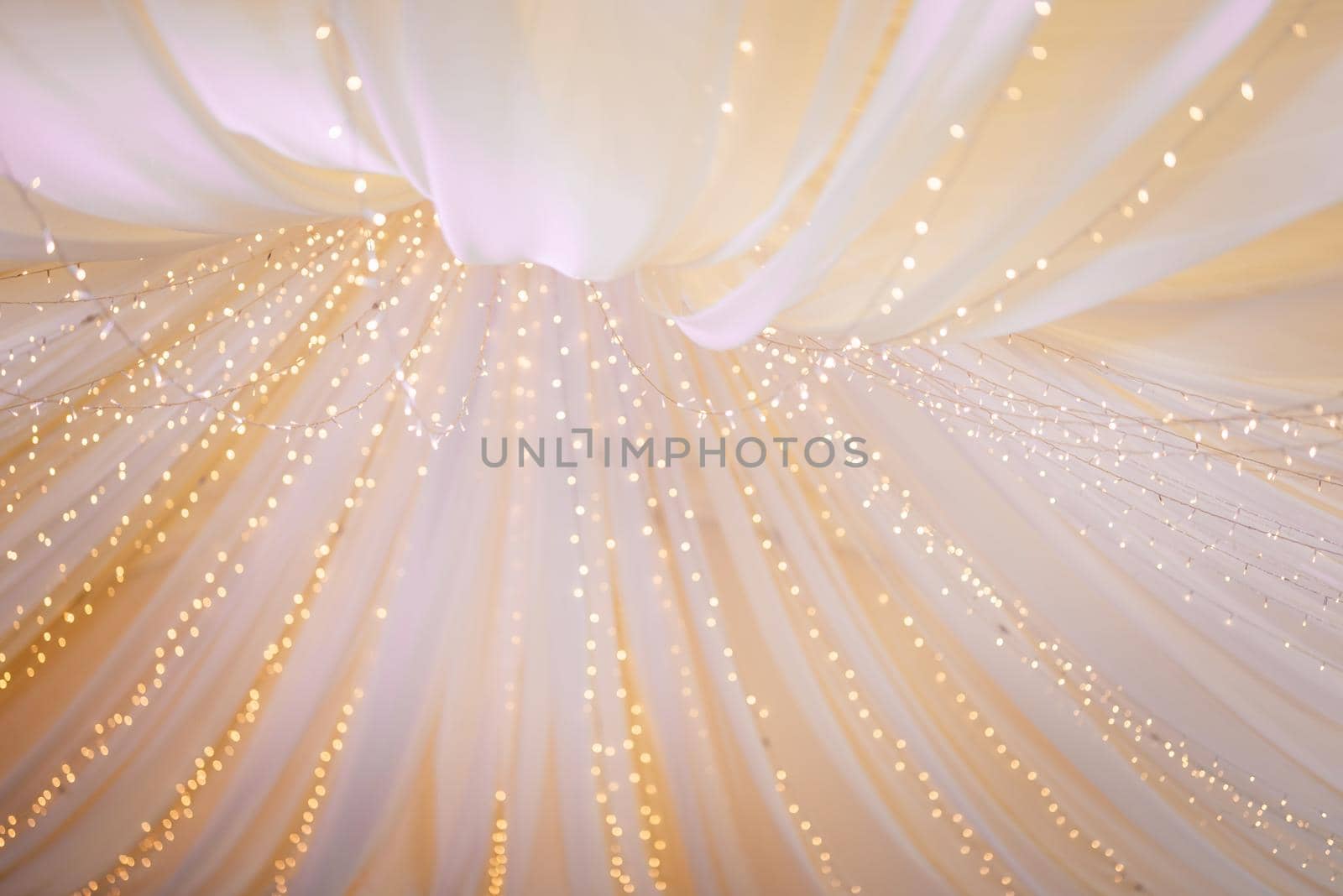 atmospheric warm light bulbs wrapped in garlands to decorate the holiday