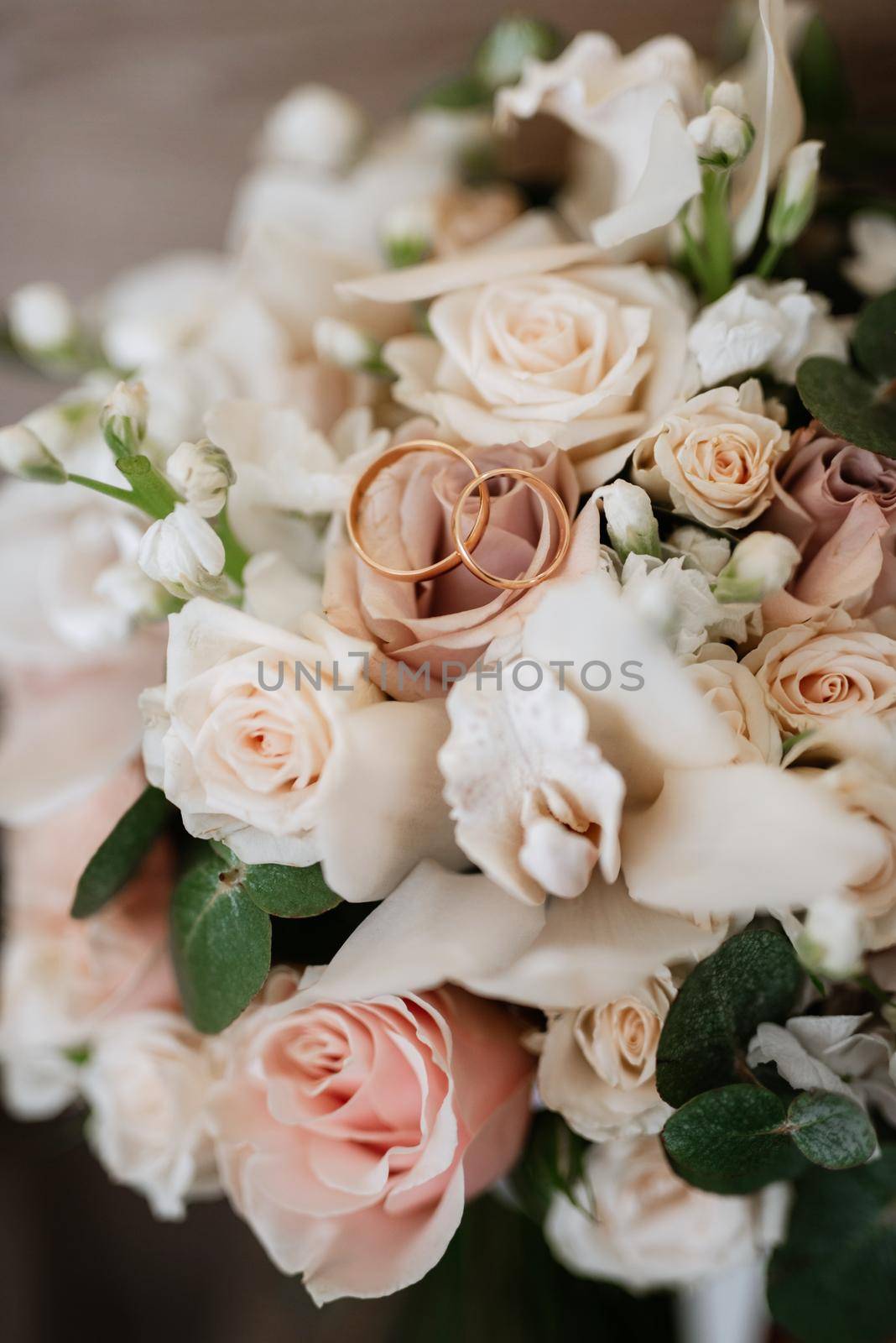 gold wedding rings as an attribute of a young couple's wedding