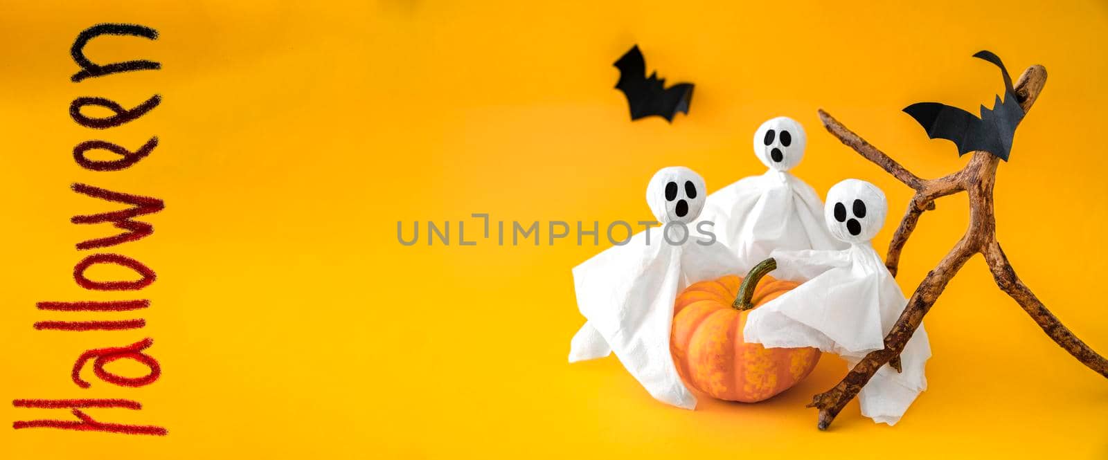 Pumpkin, gosts, bats on orange background, symbols Halloween. Copy space by Laguna781