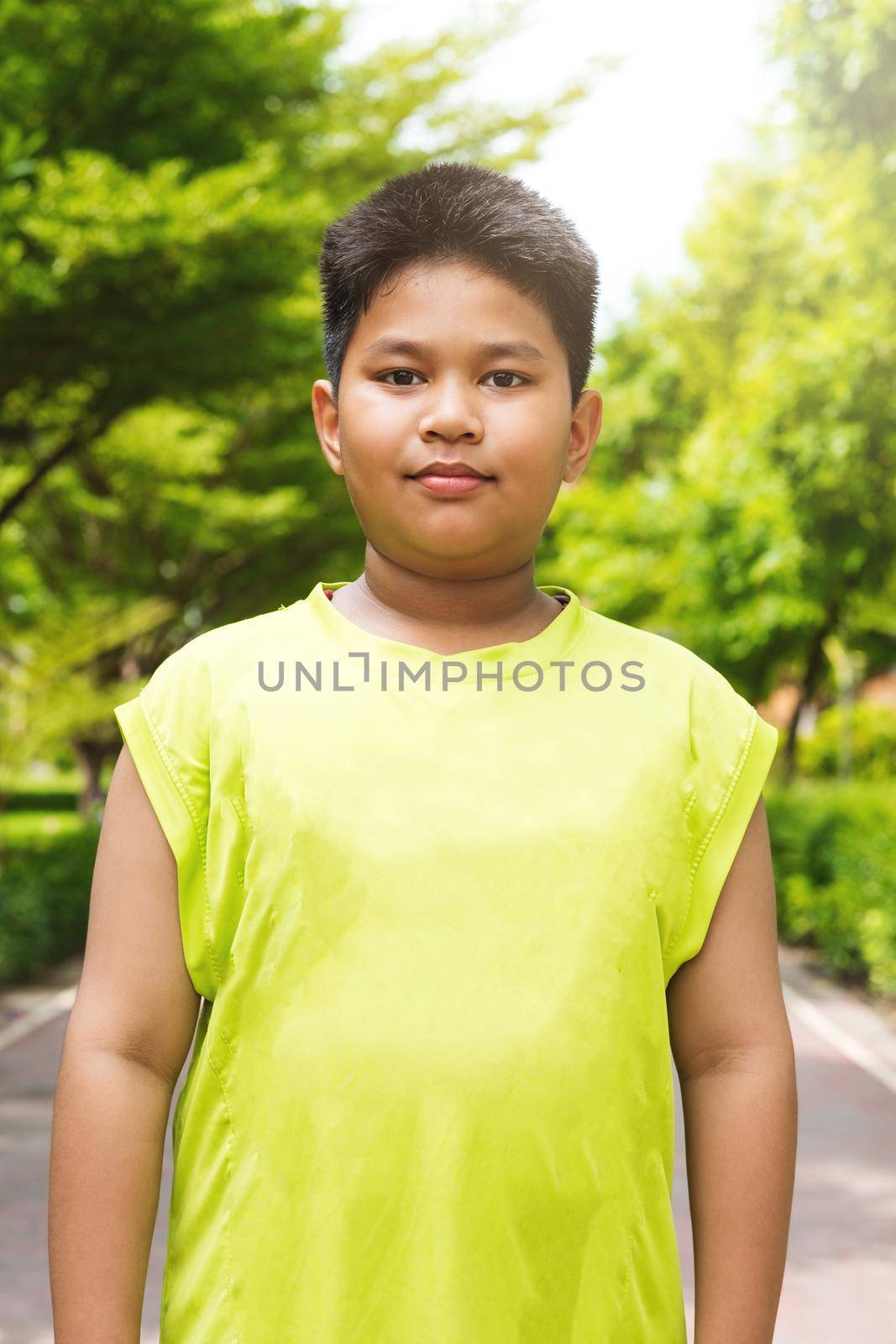 Portrait handsome asian sport boy in garden.