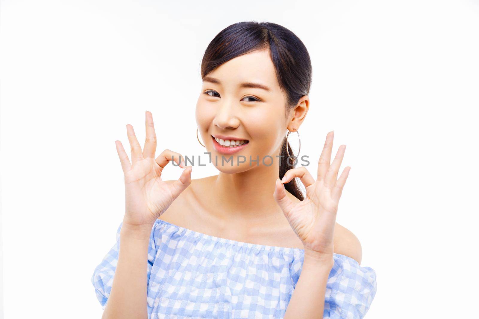 young Asian woman showing okay finger sign isolate over white background