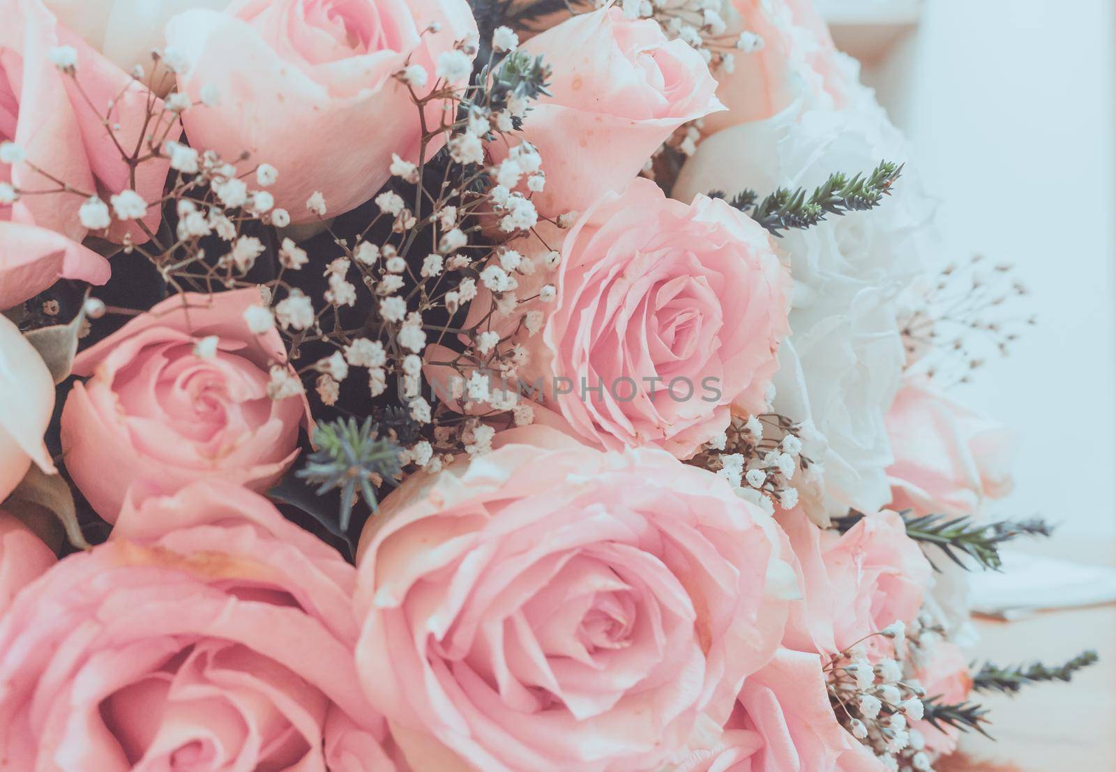 Vintage style - Abstract escalator of shopping mall, shallow depth of focus.- Pink roses well use as a wedding or valentine background