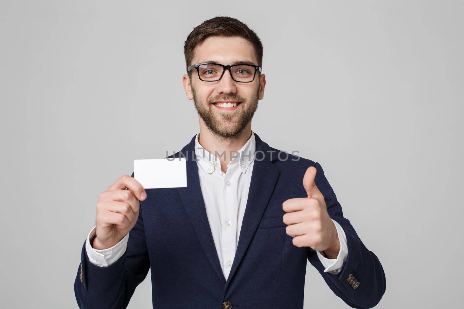 Business Concept - Portrait Handsome Business man showing name card with smiling confident face and thump up. White Background.Copy Space. by Benzoix