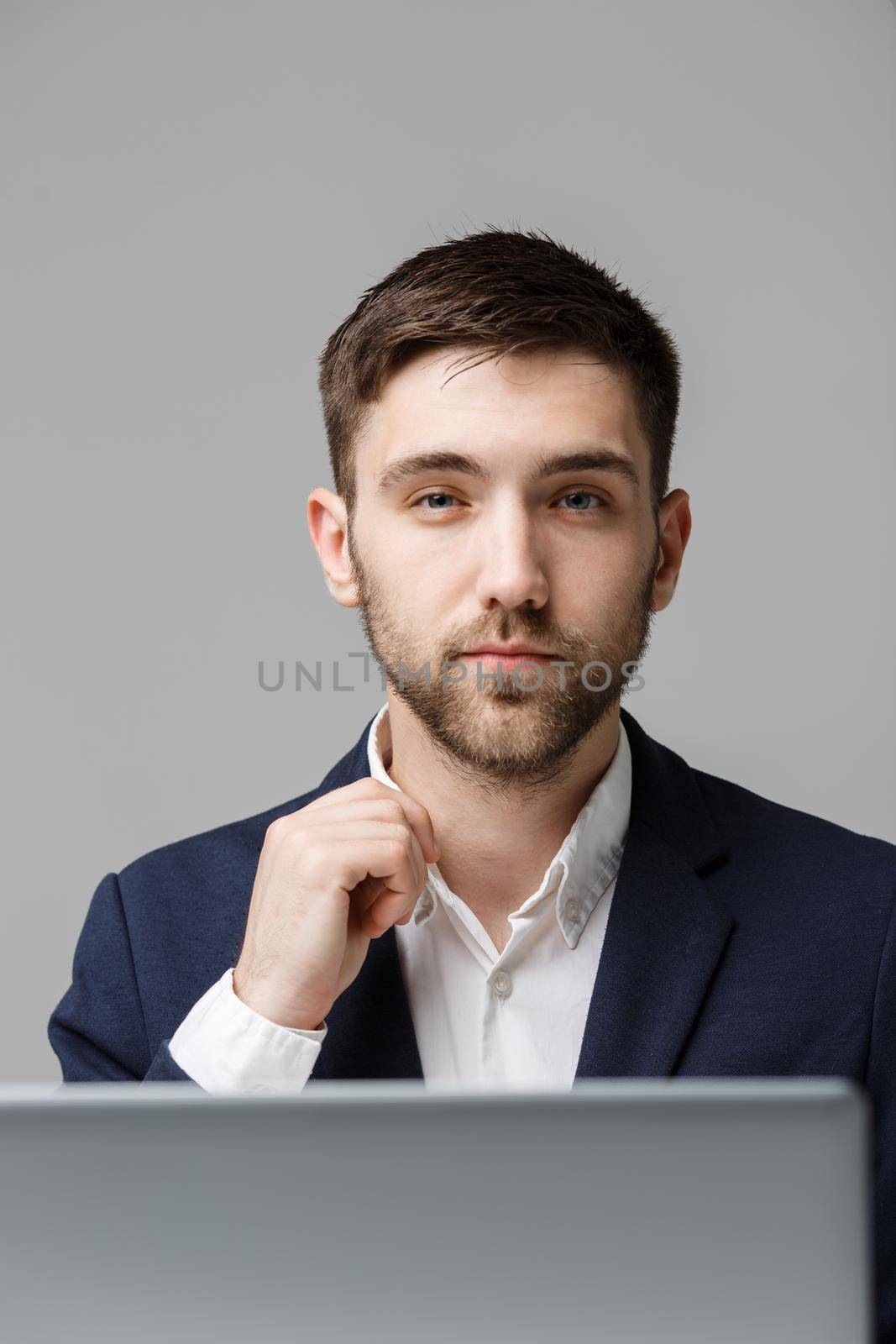Business Concept - Portrait handsome stressful business man in suit shock looking in front of laptop at work office. White Background. by Benzoix