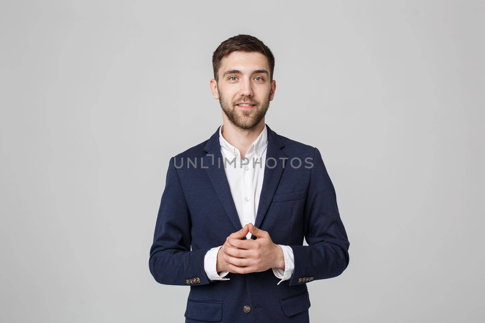 Business Concept - Portrait Handsome Business man holding hands with confident face. White Background. by Benzoix