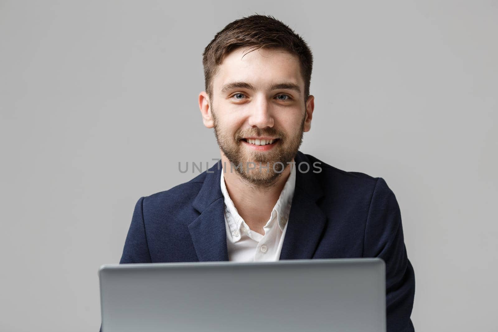 Business Concept - Portrait Handsome Business man playing digital notebook with smiling confident face. White Background.Copy Space. by Benzoix