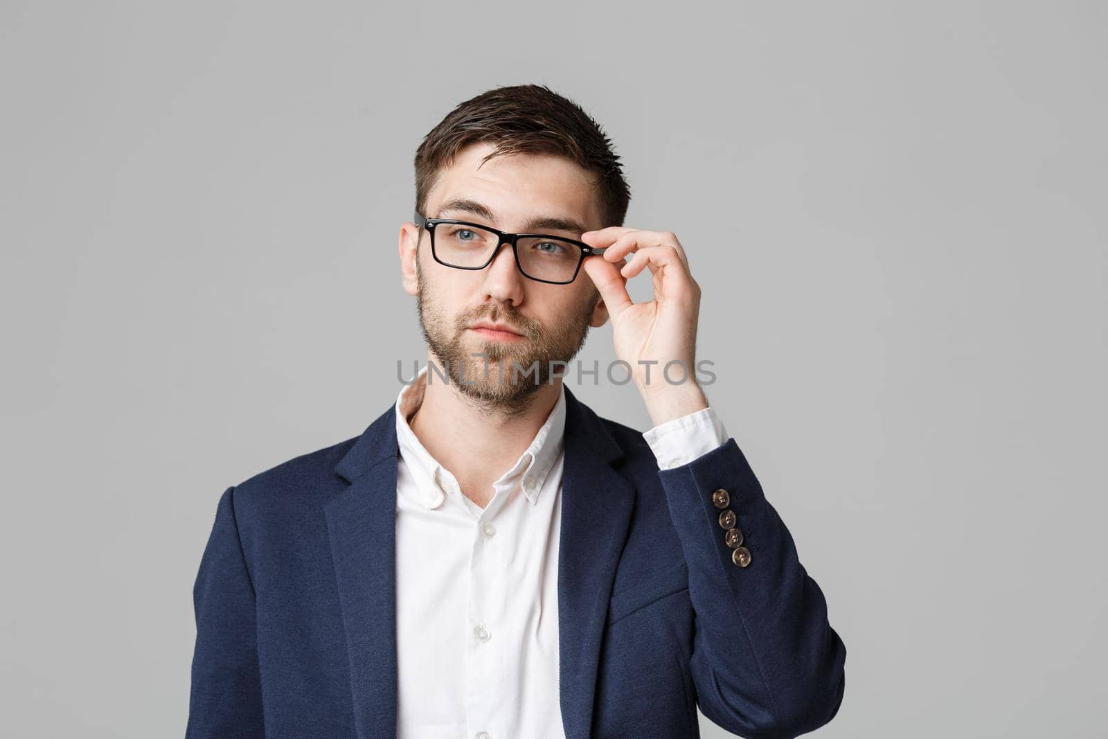 Business Concept - Portrait of a handsome businessman in suit with glasses serious thinking with stressful facial expression. Isolated White background. Copy Space.