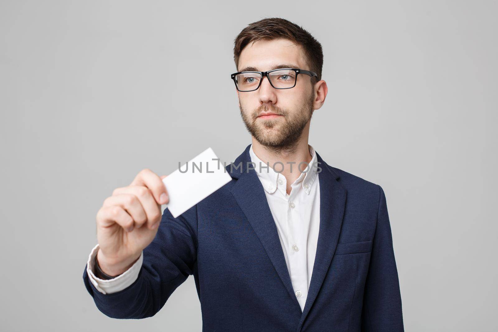 Business Concept - Portrait Handsome Business man showing name card with smiling confident face. White Background.Copy Space.