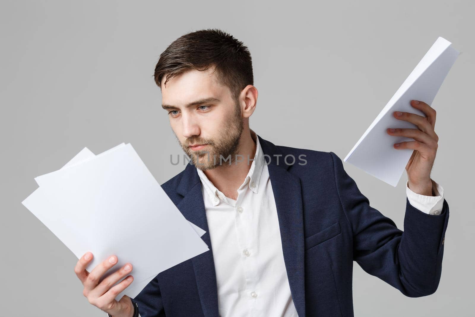 Business Concept - Portrait Handsome Business man serious working with annual report. isolated White Background. Copy space. by Benzoix