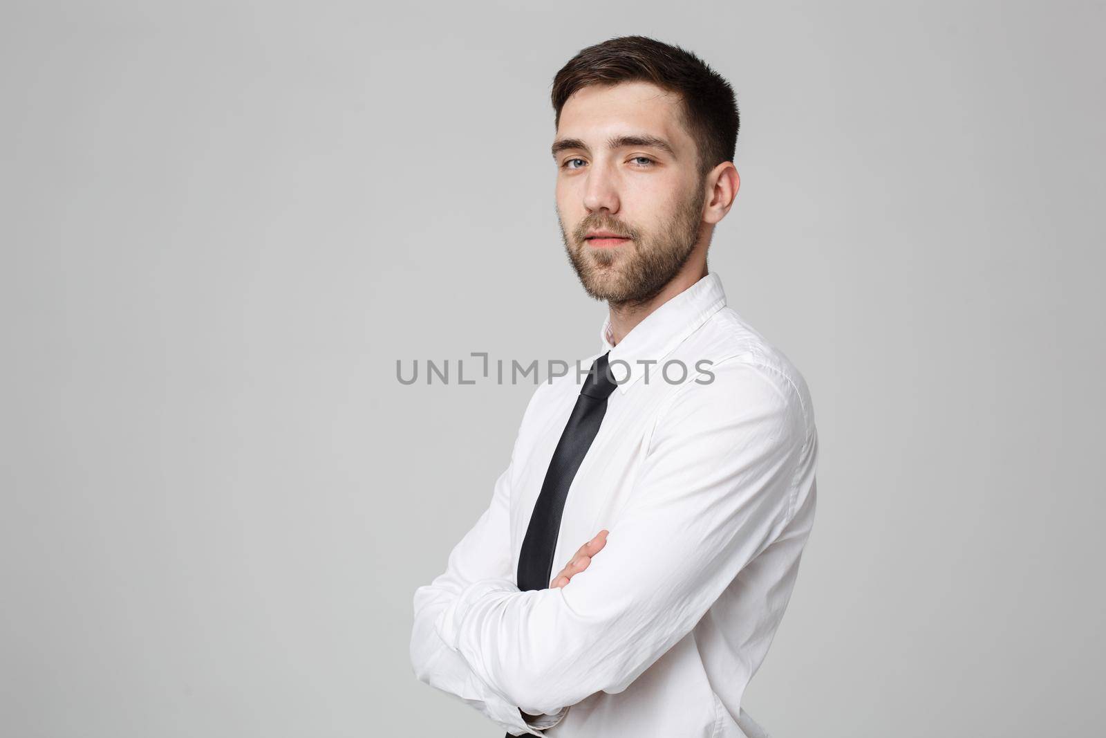 Business Concept - Handsome Business man crossed arms with confident face. White Background. by Benzoix