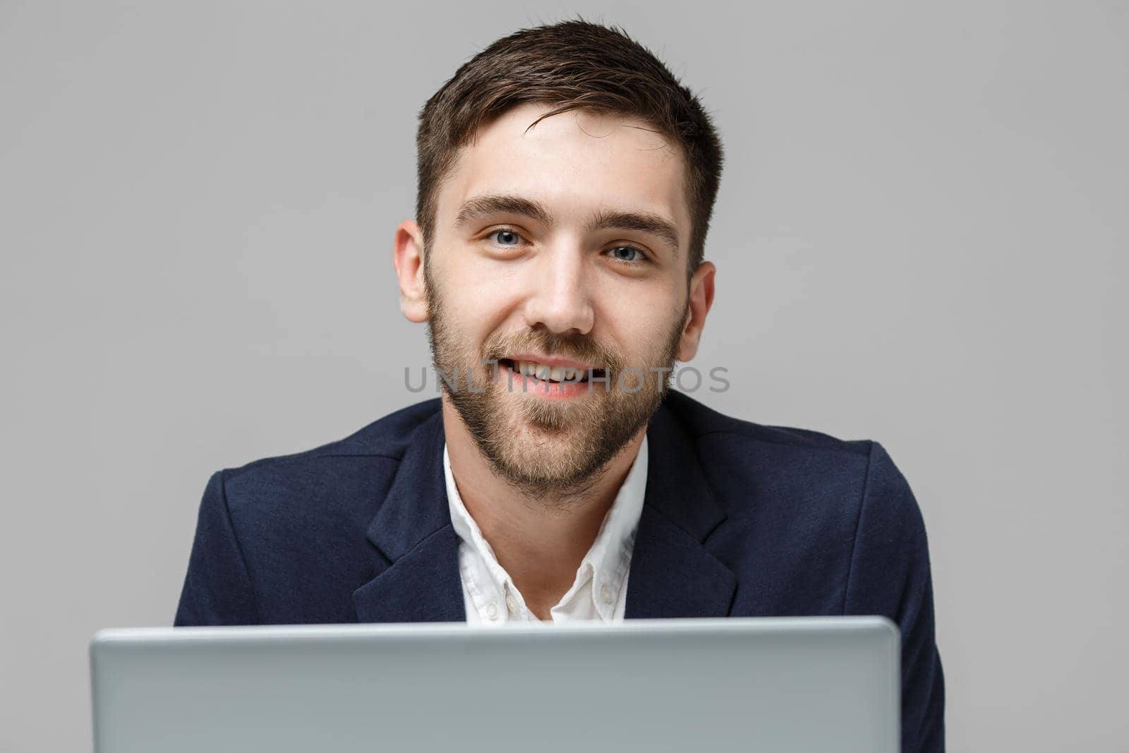 Business Concept - Portrait Handsome Business man playing digital notebook with smiling confident face. White Background.Copy Space.