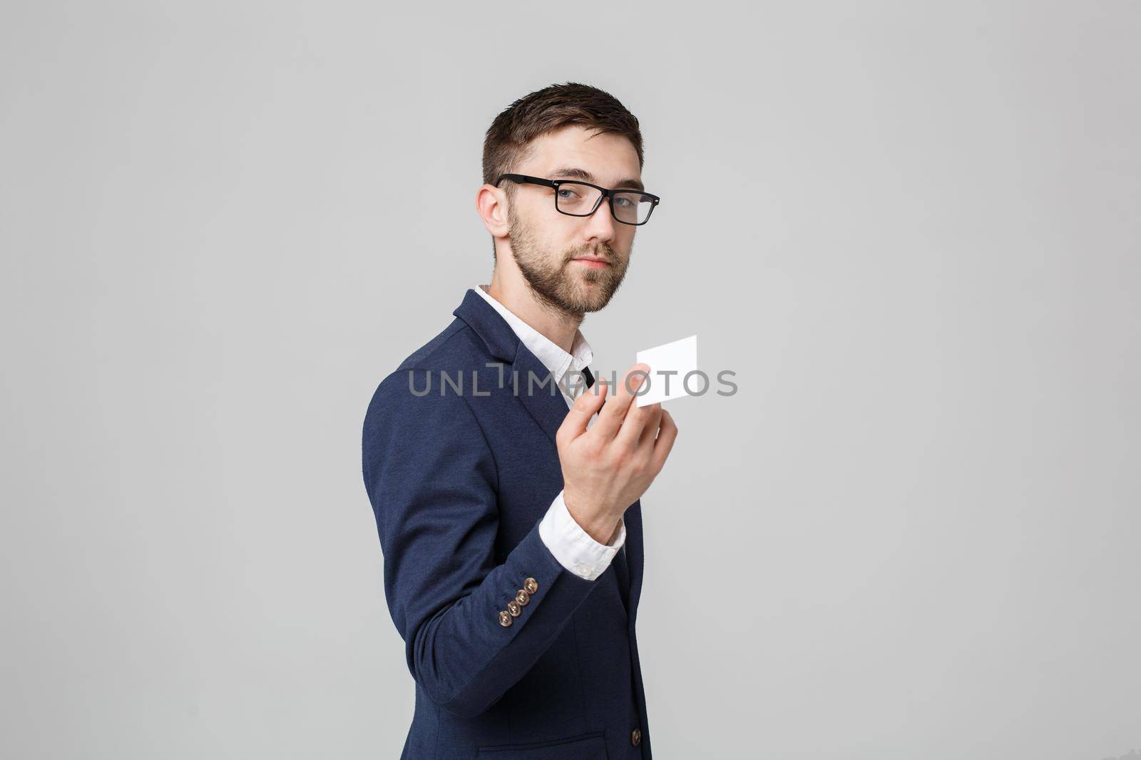 Business Concept - Portrait Handsome Business man showing name card with smiling confident face. White Background.Copy Space.