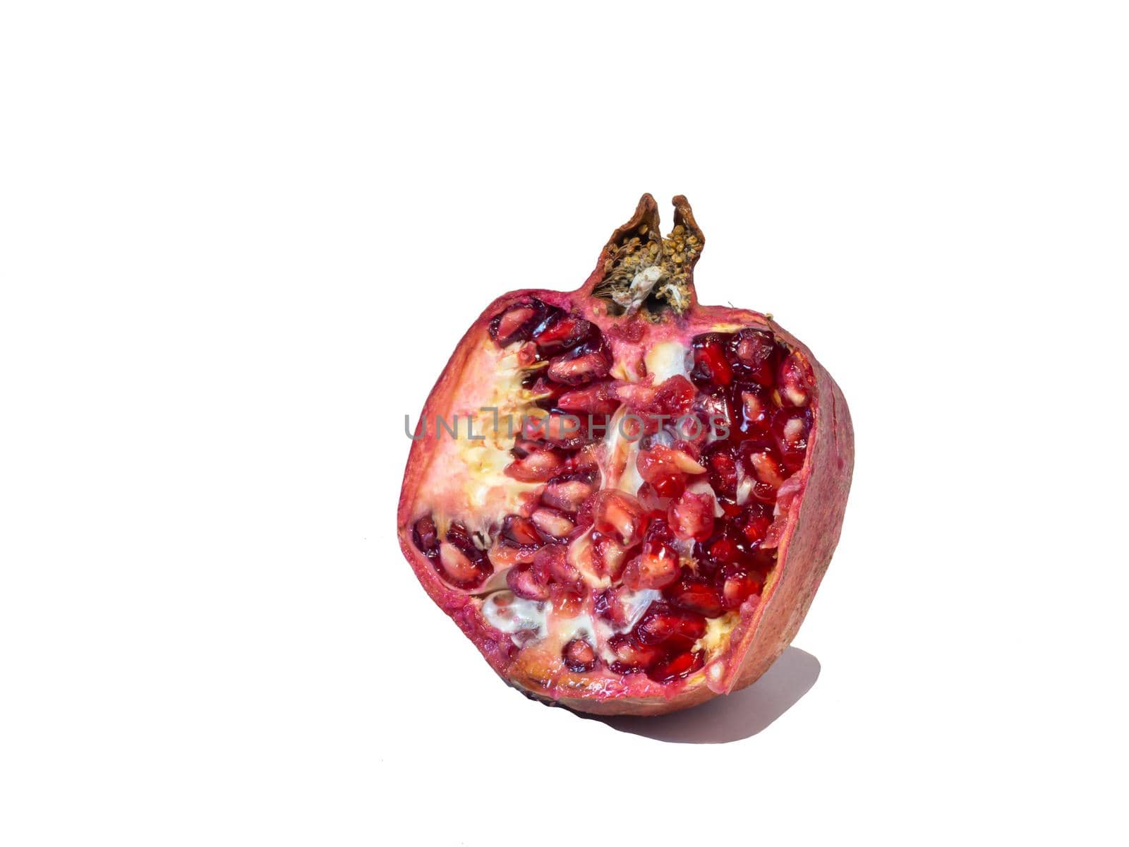 Pomegranate on white background. Useful product by Puludi
