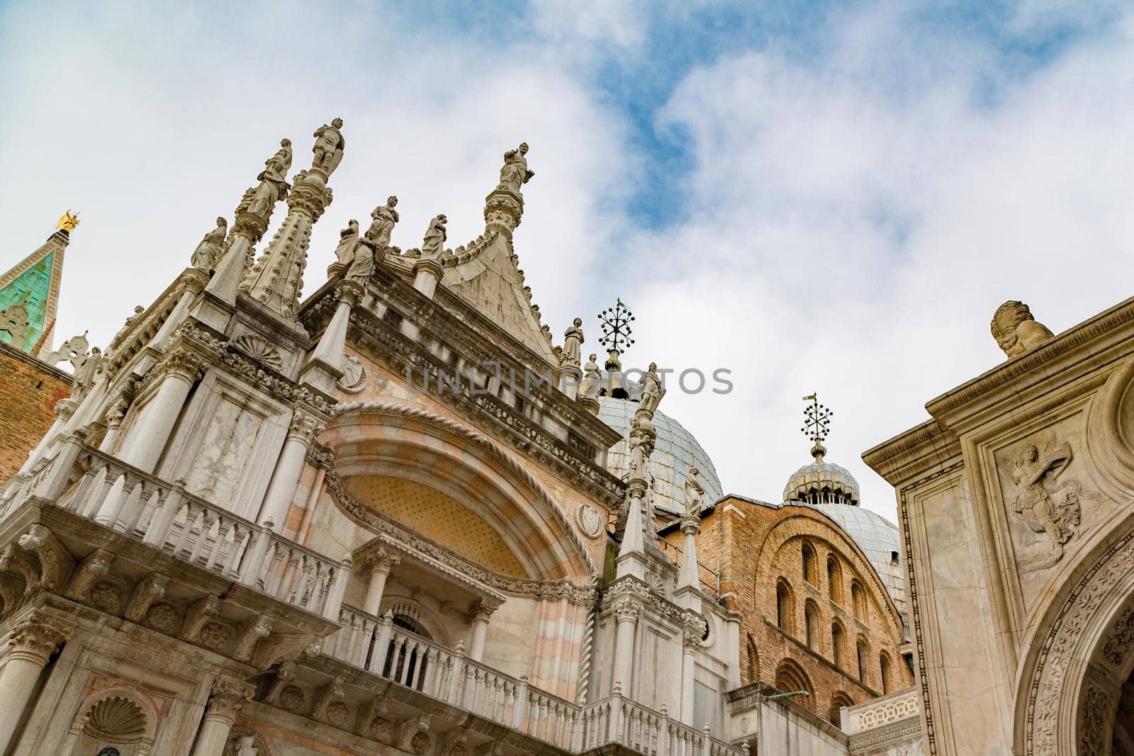 Piazza San Marco in Venice, bottom view. Basilica San Marco, Venice, Italy. Cathedral of San Marco (San Marco basilica) in Venice, Italy. Architecture postcard background.