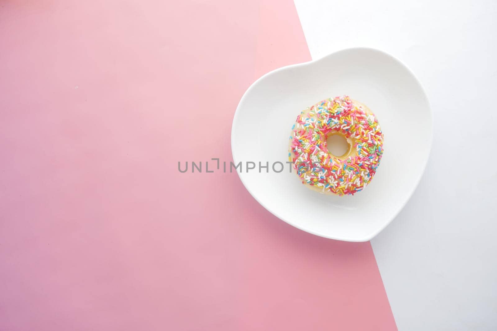 chocolate donuts on plate with copy space.